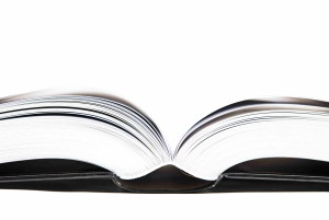 Large open book on white background